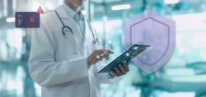 Médecin utilisant une tablette, avec un bouclier de protection des données